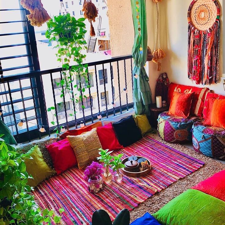 colorful throw pillows and blankets balcony